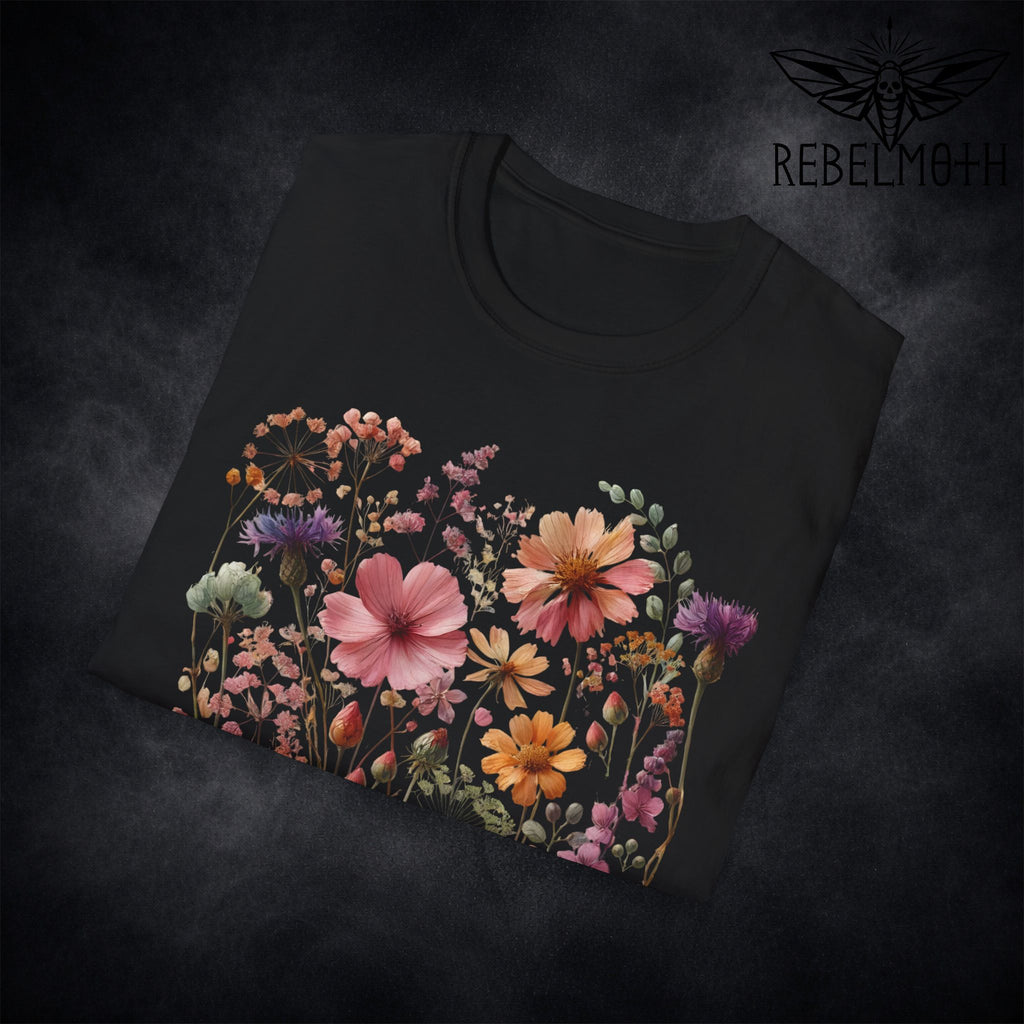 Close-up of colorful wildflower meadow print details on black t-shirt (botanical graphic)