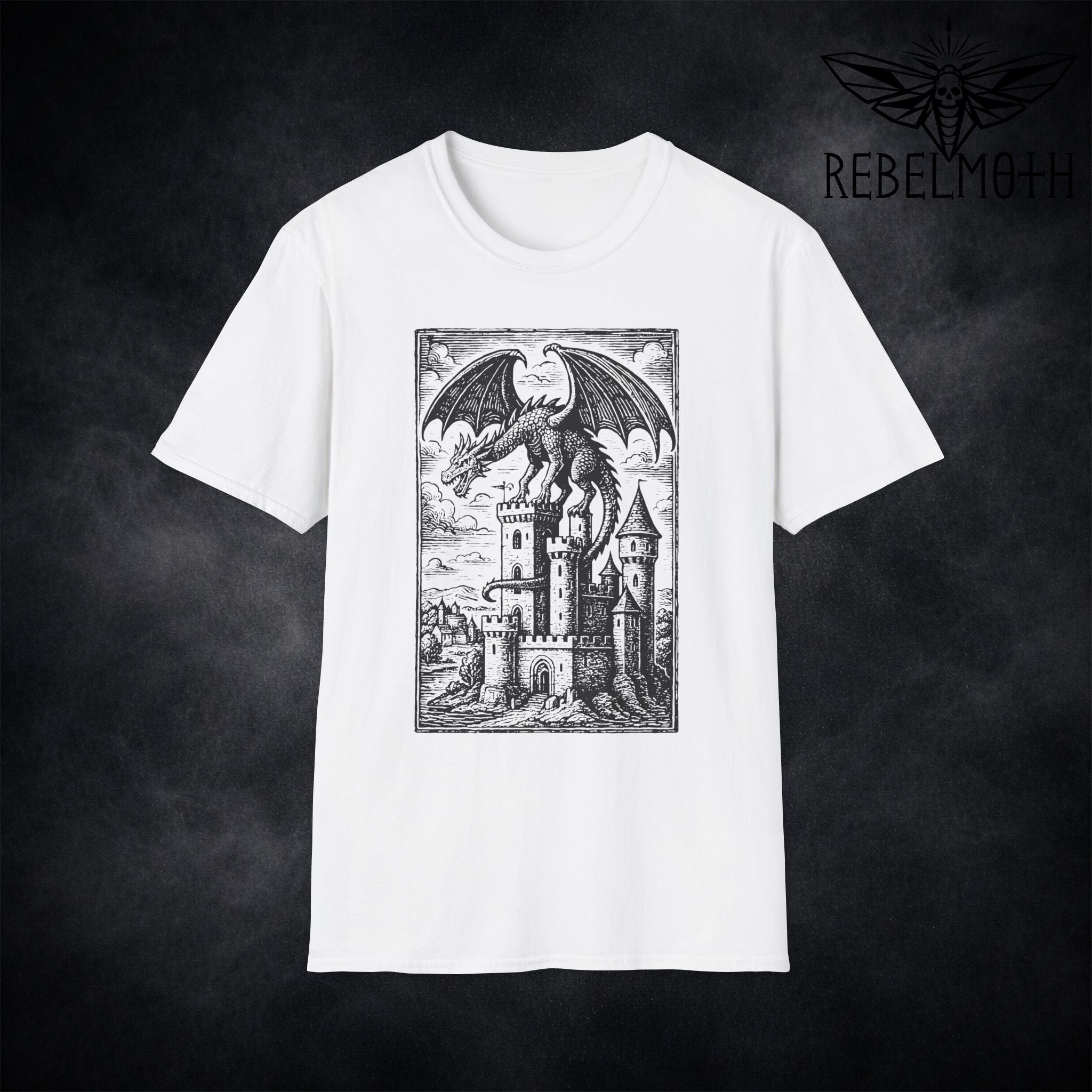 Flat lay of dragon castle dark fantasy t-shirt with medieval woodcut dragon illustration