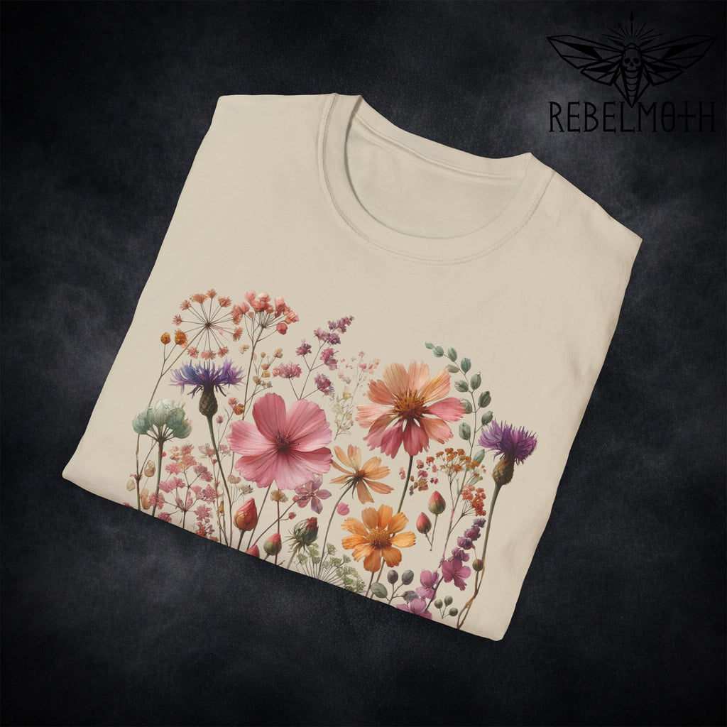 Close-up of colorful wildflower meadow print details on black t-shirt (botanical graphic)