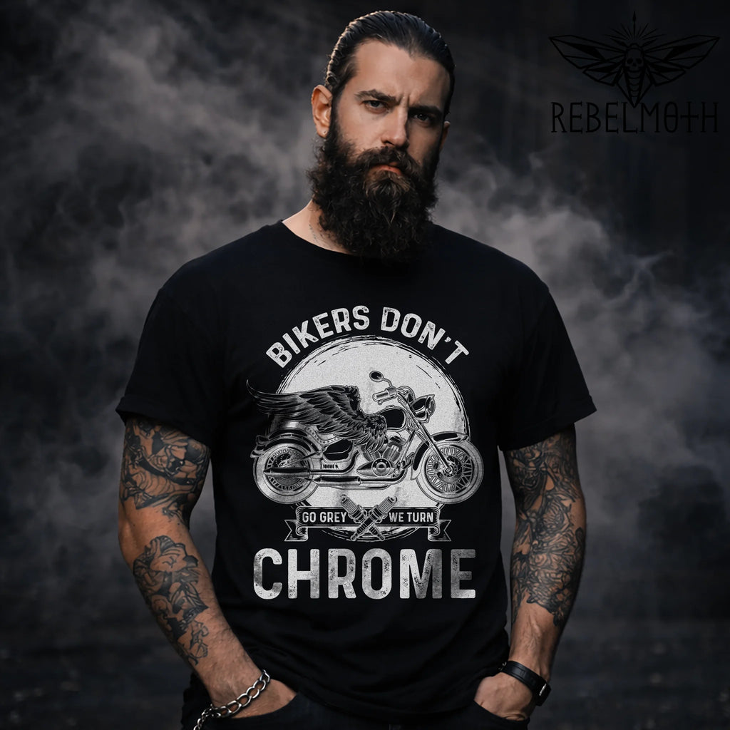 Bearded tattooed model wearing black “We Turn Chrome” motorcycle biker t-shirt, front view