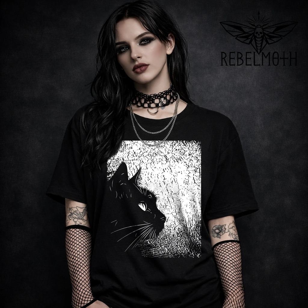 Black t-shirt with black cat silhouette profile graphic in a textured frame (dark aesthetic tee)