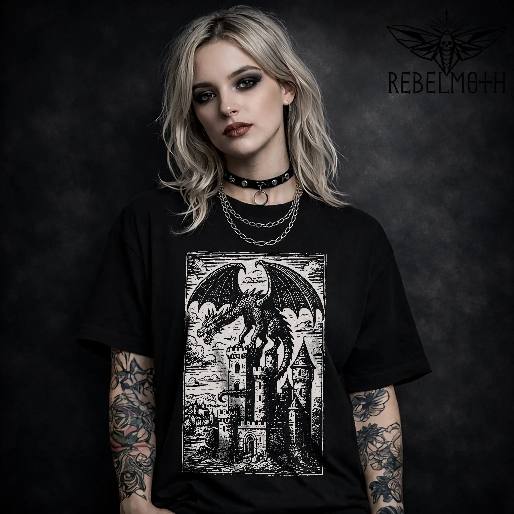 Black t-shirt with woodcut-style dragon perched on a medieval castle graphic (gothic dark fantasy tee)
