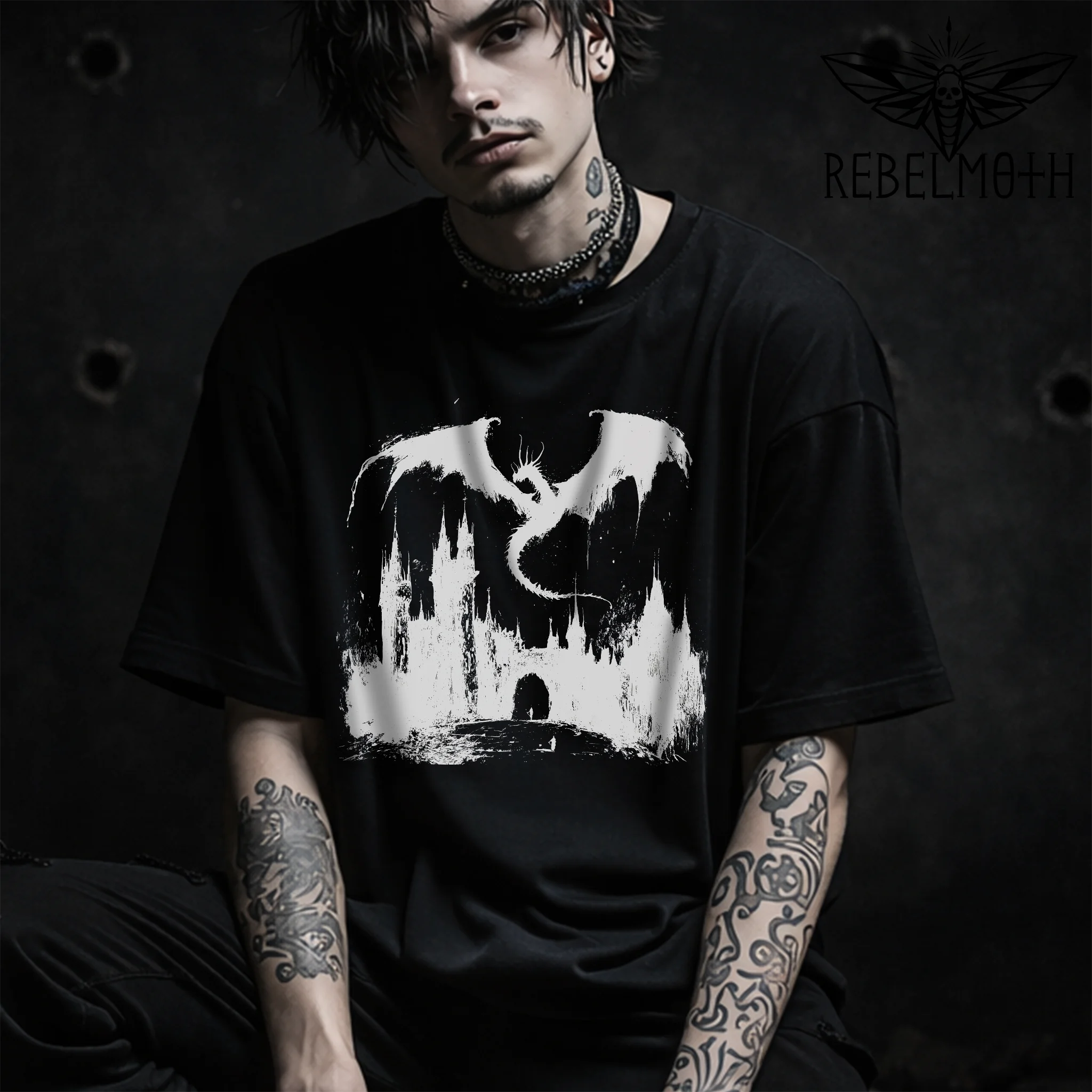 Model wearing a Black t-shirt with medieval dragon coiled around a castle dark fantasy graphic (goth/metal style)