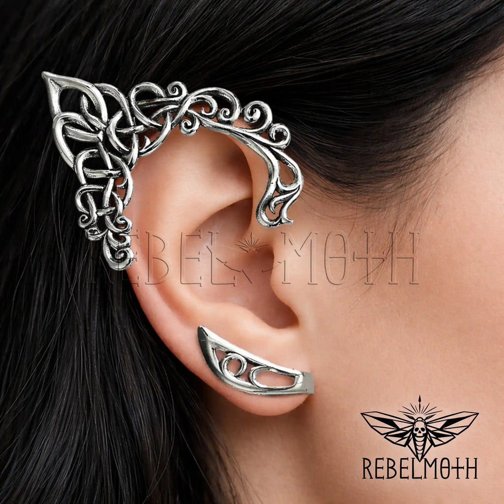 Dark elf ear cuff worn on ear in polished stainless steel with Celtic knot detail