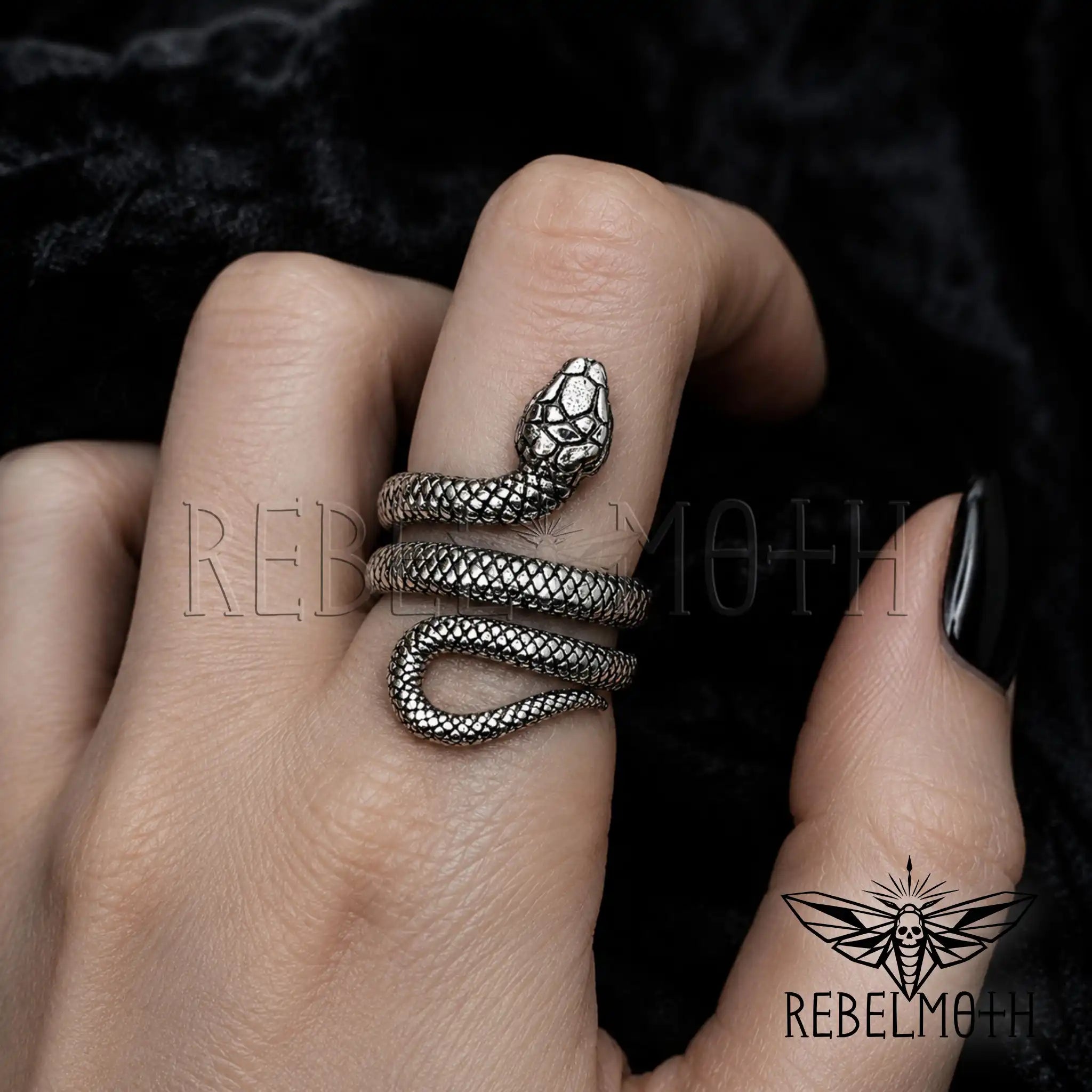 Gothic serpent ring on a woman's finger