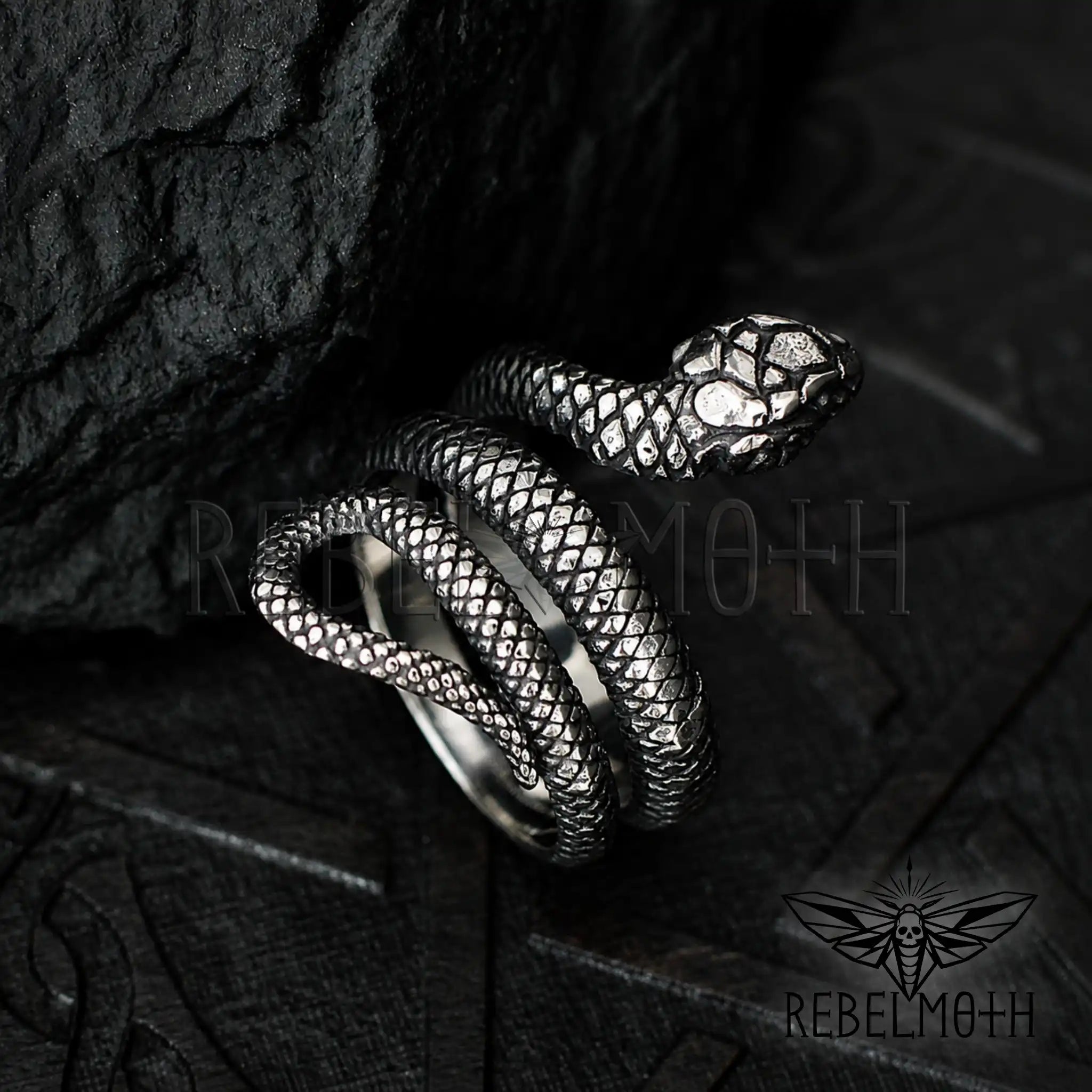 Stainless steel snake ring with coiled serpent design for gothic and alternative styling.