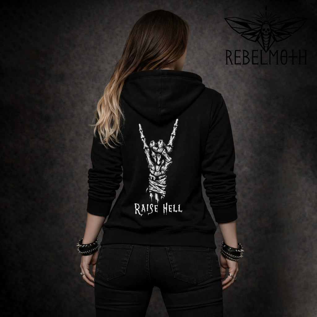Woman wearing black hoodie, back view, skeleton metal horns design with “RAISE HELL”
