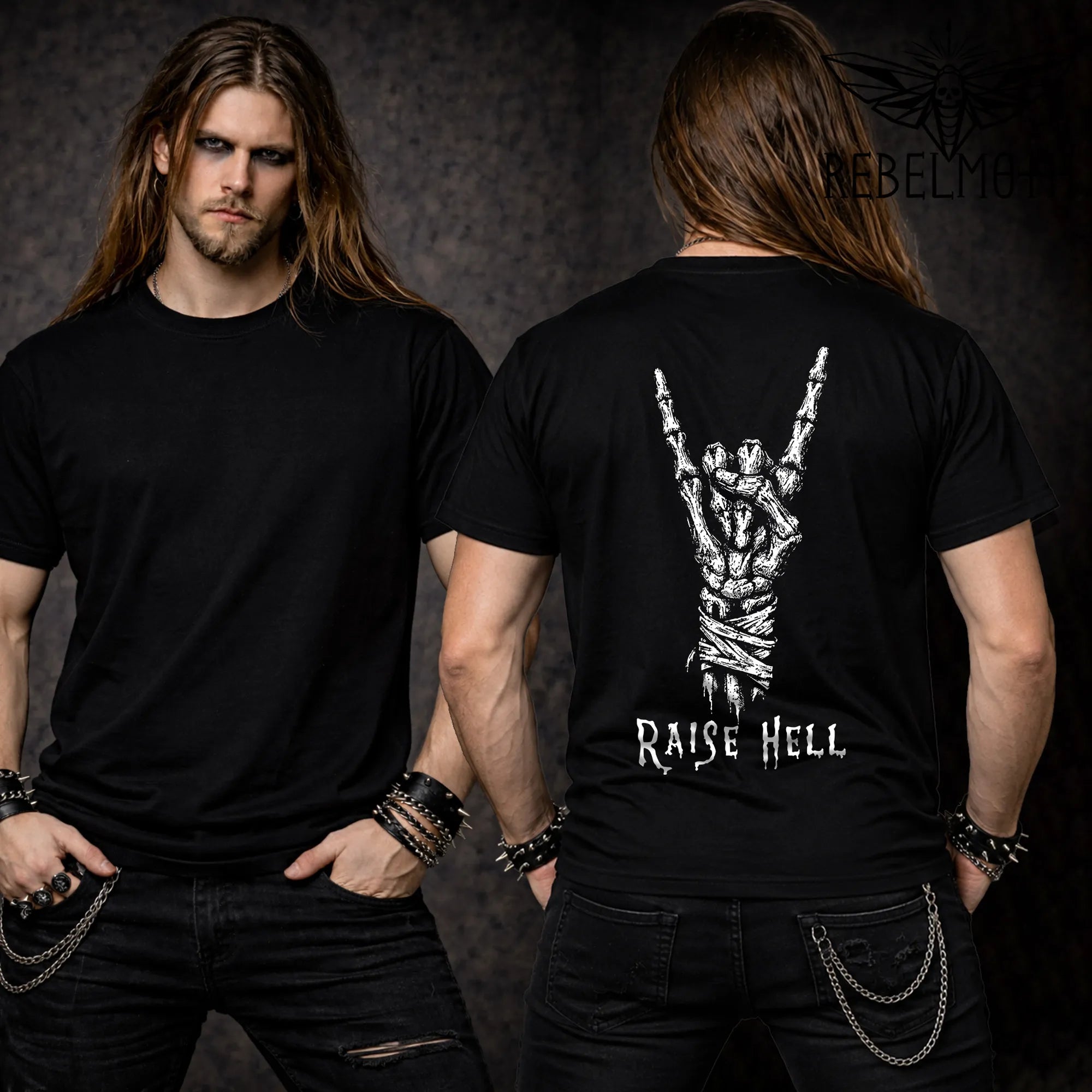 Back view of black t-shirt with skeleton hand throwing devil horns and Raise Hell text, worn by long-haired model with spiked bracelets and chain wallet