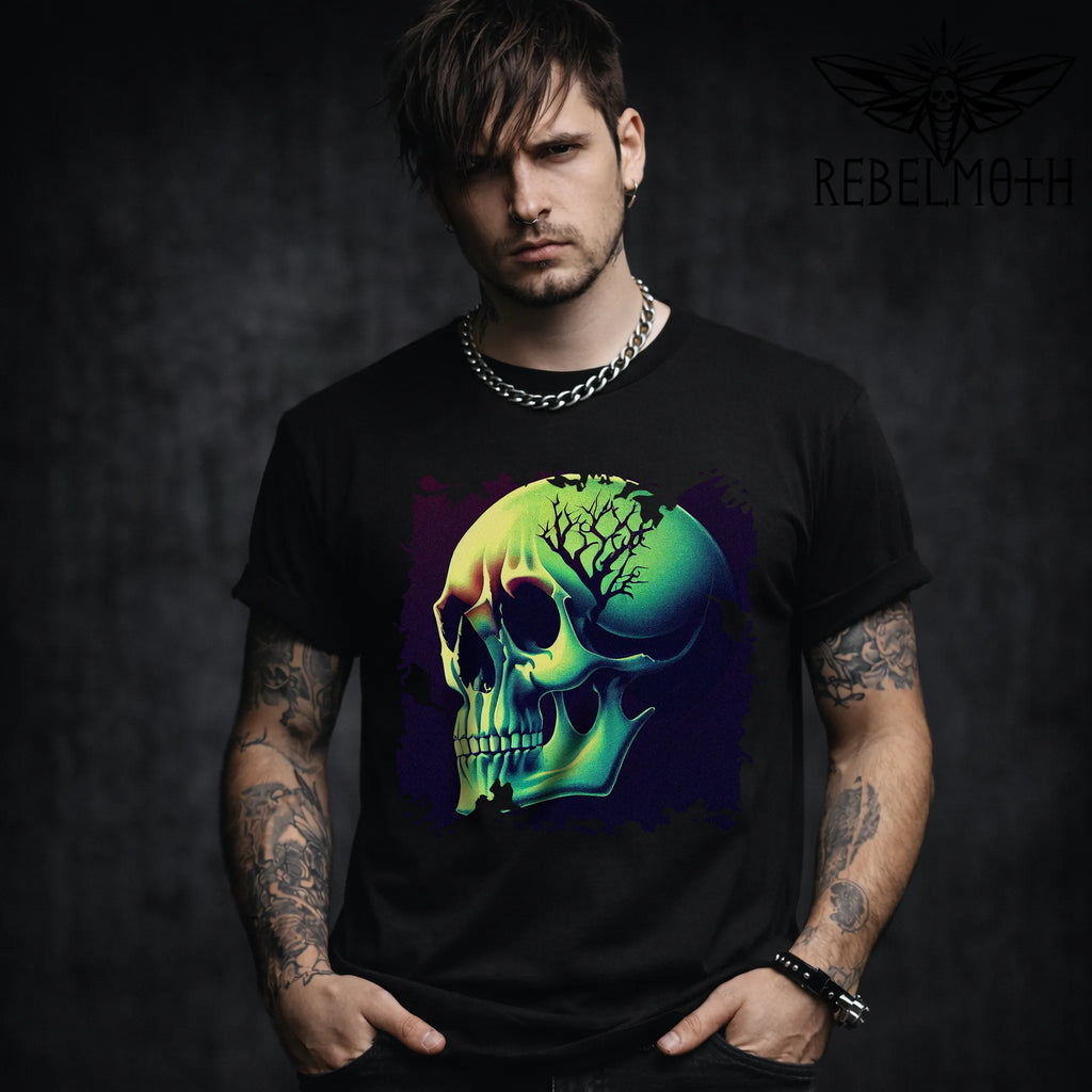 Man wearing a black t-shirt with a colorful skull design, standing against a dark background.