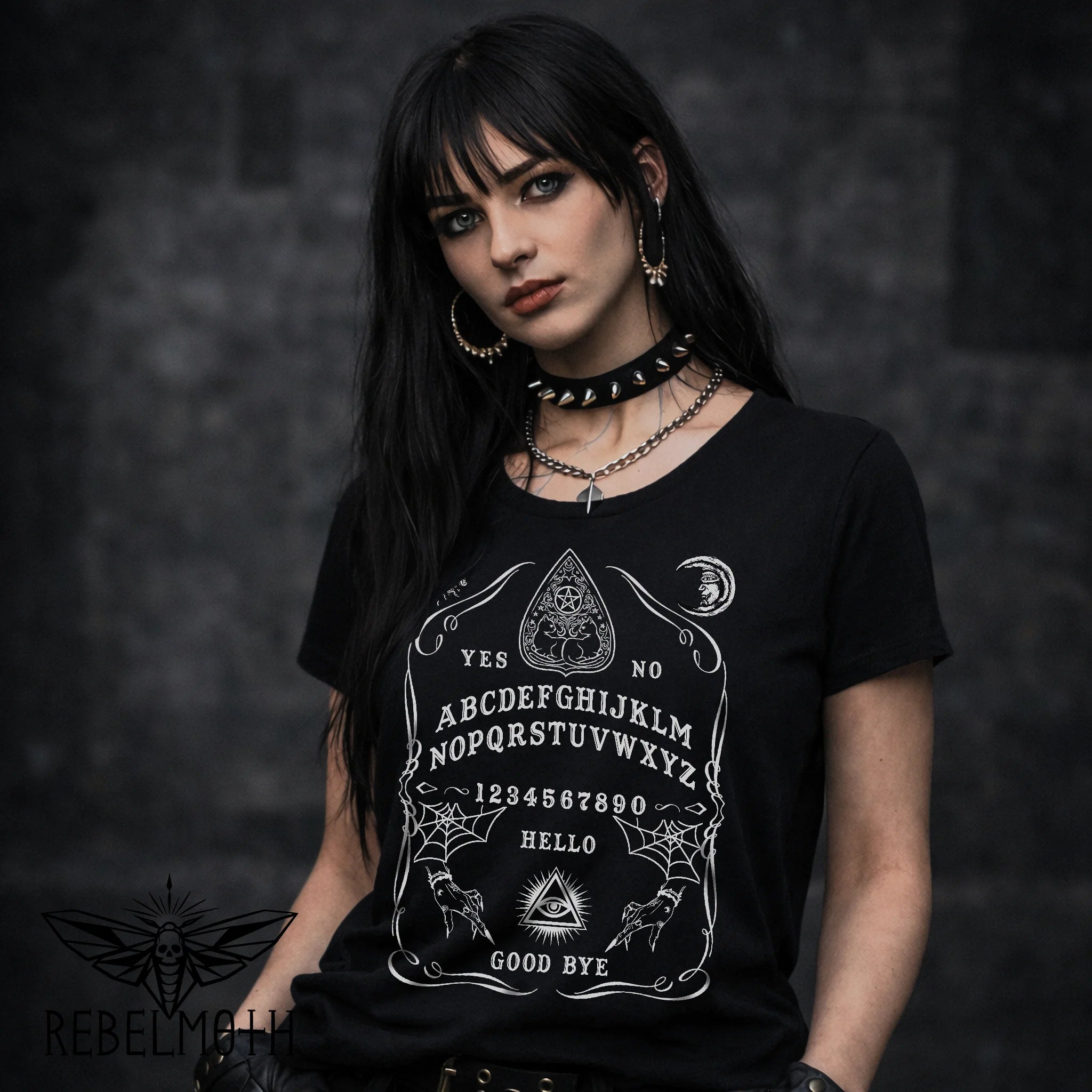 Ouija board t-shirt with a classic spirit board layout and occult symbols in bold black-and-white. Witchy goth graphic tee for alt outfits.