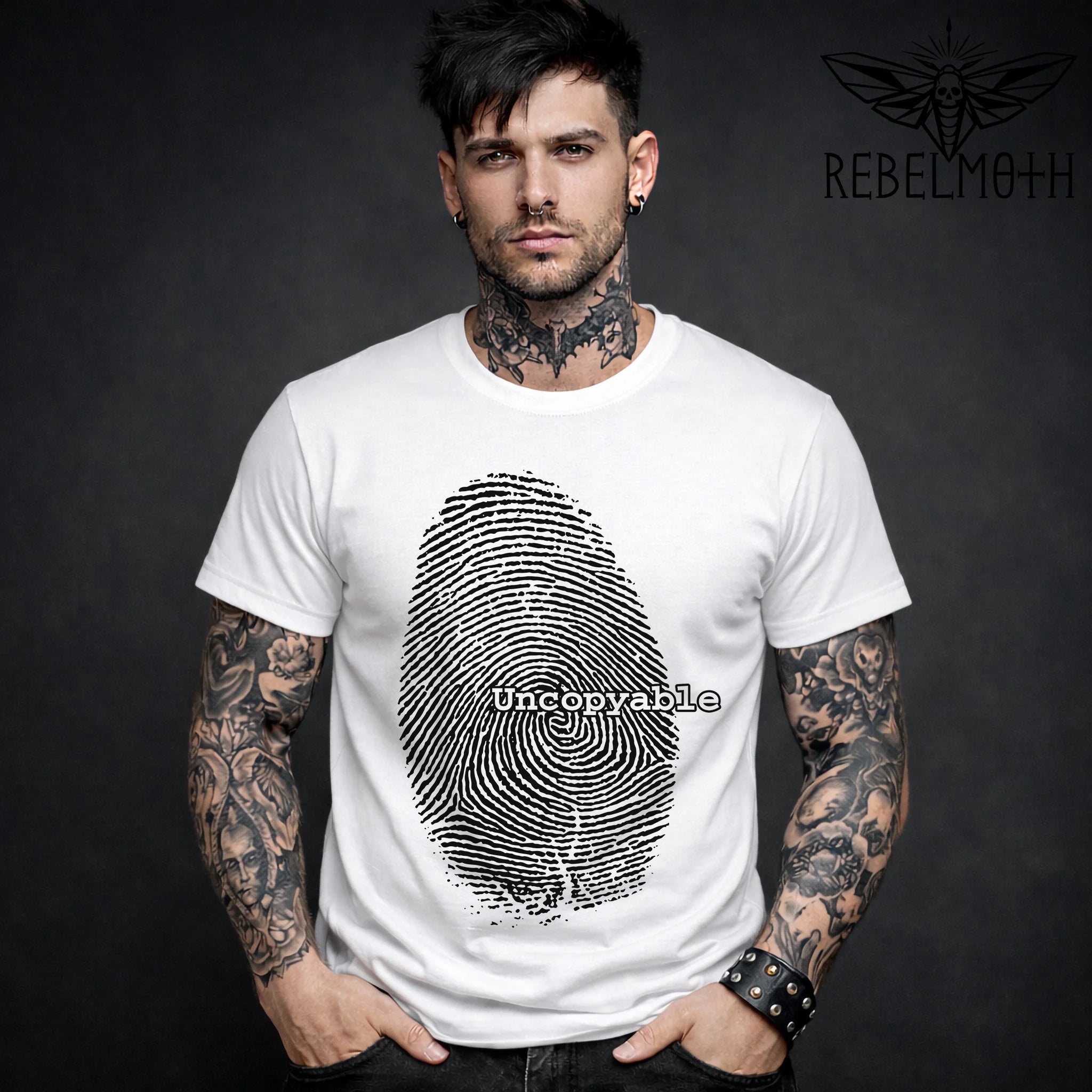 Man wearing a white grunge t-shirt with a fingerprint design and 'Uncopyable' text.
